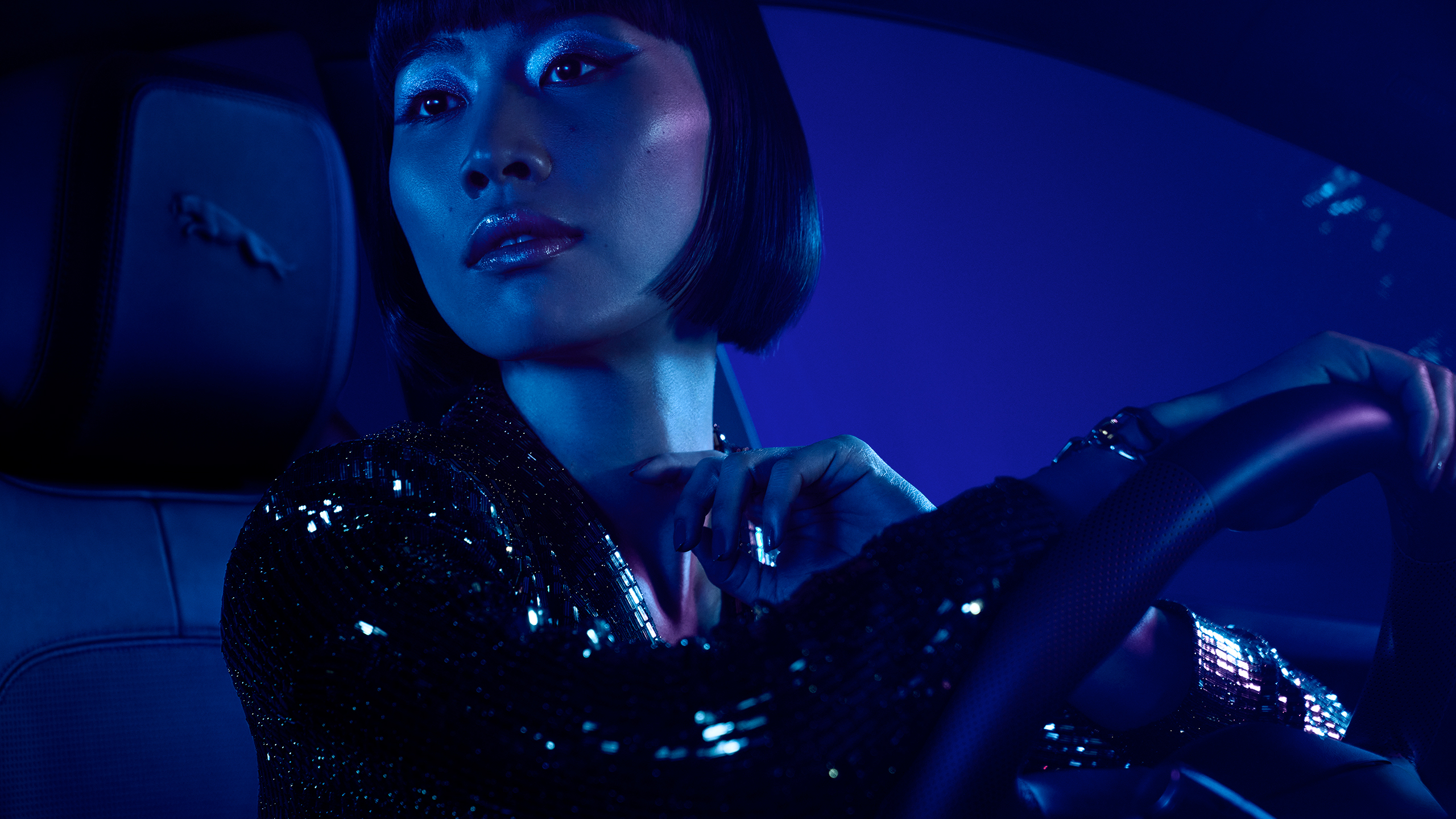 Woman driving Jaguars E-PACE